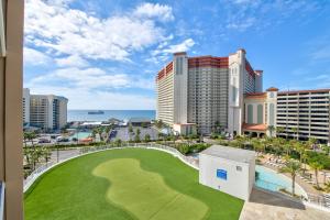 a golf course in front of a resort at Beach Nest Escape - 5 Pools, Hot Tub, Gym, Wi-Fi in Panama City Beach