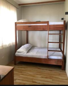 a couple of bunk beds in a room at Charish del Mar in Baganga