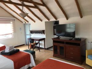 Postel nebo postele na pokoji v ubytování hotel el portal de las Flores, Alojamiento Rural
