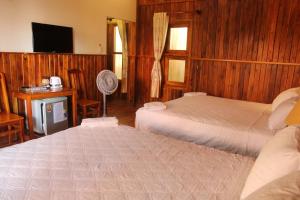 Postel nebo postele na pokoji v ubytování Viet Thanh Resort