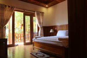 Postel nebo postele na pokoji v ubytování Viet Thanh Resort