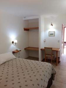 Ένα ή περισσότερα κρεβάτια σε δωμάτιο στο Hosteria Mi Vida