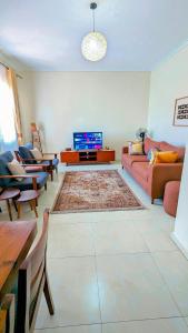 TV a/nebo společenská místnost v ubytování Ahva III Residence