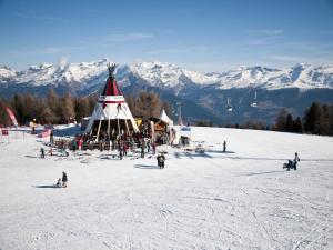 a group of people on a ski slope in the snow at Alluring apartment in Les Agettes in Agettes