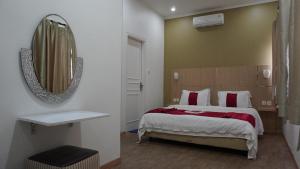 Postel nebo postele na pokoji v ubytování Diyar Villas Puncak K3/2A