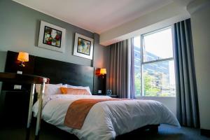Postel nebo postele na pokoji v ubytování Apart Hotel Petit Palace Suites