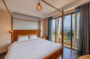 Postel nebo postele na pokoji v ubytování Guava Hill Boutique Hotel