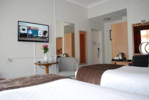 Postel nebo postele na pokoji v ubytování Thistle London Bloomsbury Park