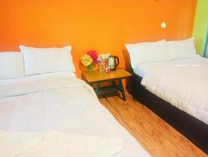 A bed or beds in a room at Hotel Butterfly - Peaceful Garden for Nature Lovers