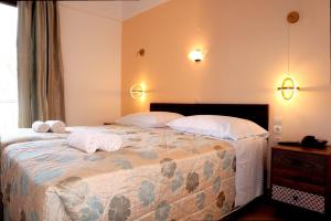 Кровать или кровати в номере Hotel Molyvos I