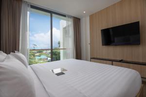 Postel nebo postele na pokoji v ubytování Elite Atoll Serviced Apartments Phuket