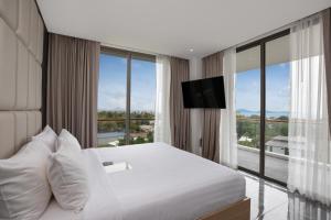Postel nebo postele na pokoji v ubytování Elite Atoll Serviced Apartments Phuket + 37 fotografií