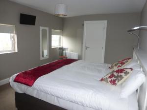 Voodi või voodid majutusasutuse Ryan's Hotel toas