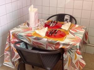 a table with a table cloth on top of it at AMI LODGE in Mamoudzou