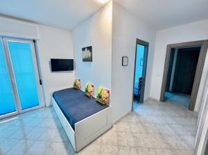 a bedroom with a bed with pillows on it at Antonio's Home in Bari