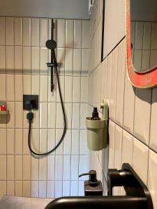 a bathroom with a shower and a sink at D a c h a in Ventspils