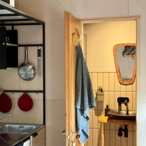 a bathroom with a sink and a mirror at D a c h a in Ventspils +14 photos