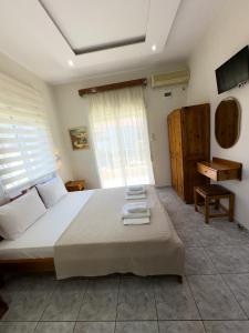 En eller flere senge i et værelse på Studios Melida