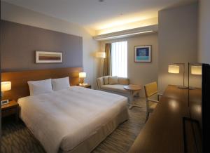 Postel nebo postele na pokoji v ubytování Odakyu Hotel Century Sagami Ono + 26 fotografií