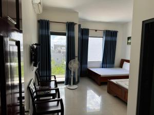 Postel nebo postele na pokoji v ubytování Nhà Nghỉ Nhung - Nhung Motel