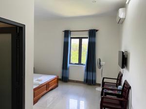 Postel nebo postele na pokoji v ubytování Nhà Nghỉ Nhung - Nhung Motel