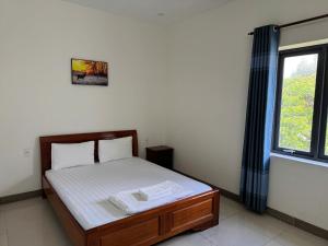 Postel nebo postele na pokoji v ubytování Nhà Nghỉ Nhung - Nhung Motel