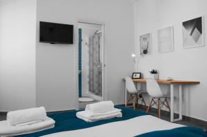 Postel nebo postele na pokoji v ubytování B&B Fuori Squadro - In Centro con Terrazza Relax vista Mare