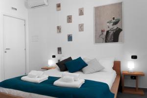 Postel nebo postele na pokoji v ubytování B&B Fuori Squadro - In Centro con Terrazza Relax vista Mare