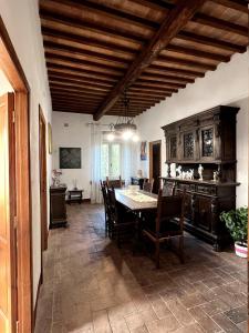 a kitchen with a table and chairs in a room at Apartment in Castle 27 Leonardo da Vinci street in Cerreto Guidi