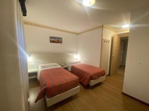 Postel nebo postele na pokoji v ubytování Hotel International