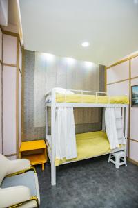 a bunk bed room with two bunk beds in it at Elite Guest House in the heart of Downtown Ulaanbaatar in Ulaanbaatar