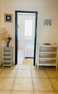 a room with a door leading to a bedroom at Le cocon familial in Digne-les-Bains +19 photos