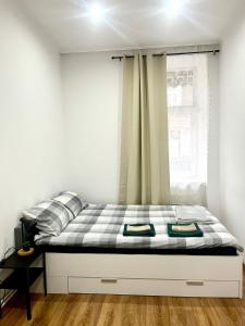 En eller flere senge i et værelse på La guitarra apartment - 1 min od dworca + 18 billeder