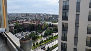 a view of a city from a window of a building at Cozy apartment in Prishtinë +2 photos