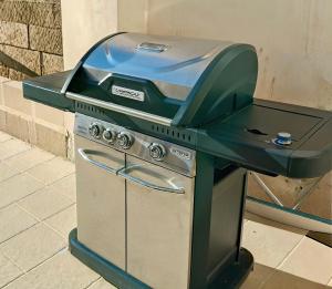 a barbeque grill sitting on top of a stove at I Tre Pumi in Surbo