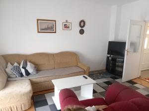 a living room with a couch and a table at Apartman View in Trebinje