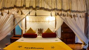 Postel nebo postele na pokoji v ubytování Hotel Kamrel Sigiriya