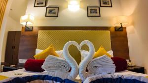 Postel nebo postele na pokoji v ubytování Hotel Kamrel Sigiriya