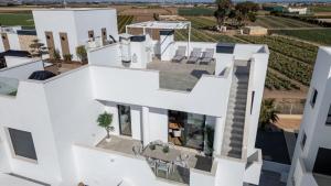 an aerial view of a white house at Santa Rosalía Lake & Life Resort Penthouse in Torre-Pacheco