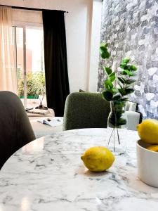 a table with a vase with a lemon on it at Tanger Beach - house in Tangier +26 photos