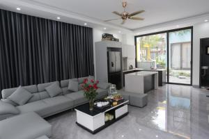 Χώρος καθιστικού στο Flamingo Hải Tiến - Minh Đức Villa A703