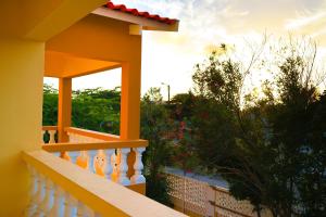 a view of a balcony of a house at Coconut Inn in Palm-Eagle Beach