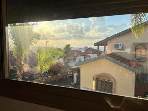 a view from a window of a house at אולימפוס in Shelomi