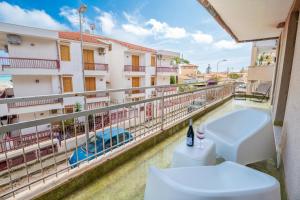 a balcony with a toilet and a view at siciliacasevacanze - Marina Domus 35 in Marina di Ragusa +14 photos
