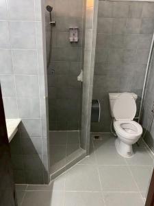 a bathroom with a toilet and a shower at AT ASok Vintage House Near BTS Asok MRT Sukhumvit in Khlong Toei