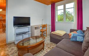 TV a/nebo společenská místnost v ubytování Villa Plage À Pieds