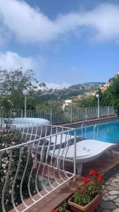 a swimming pool with a surfboard sitting next to a pool at Villa Asia Relais in Massa Lubrense