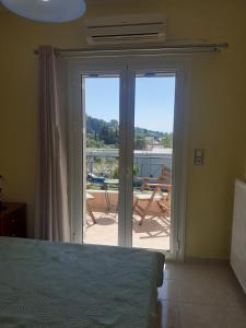 Кровать или кровати в номере SIMOS' sea view house