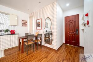 a kitchen and dining room with a table and chairs at Paradise Hotel & Apartment Âu Cơ - Tay Ho Lake in Hanoi