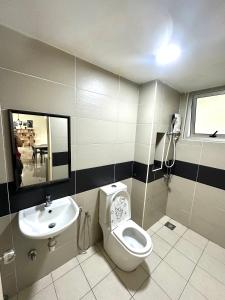 a bathroom with a toilet and a sink at Saville Cheras 2 Bedroom HomeStay Link MRT in Cheras